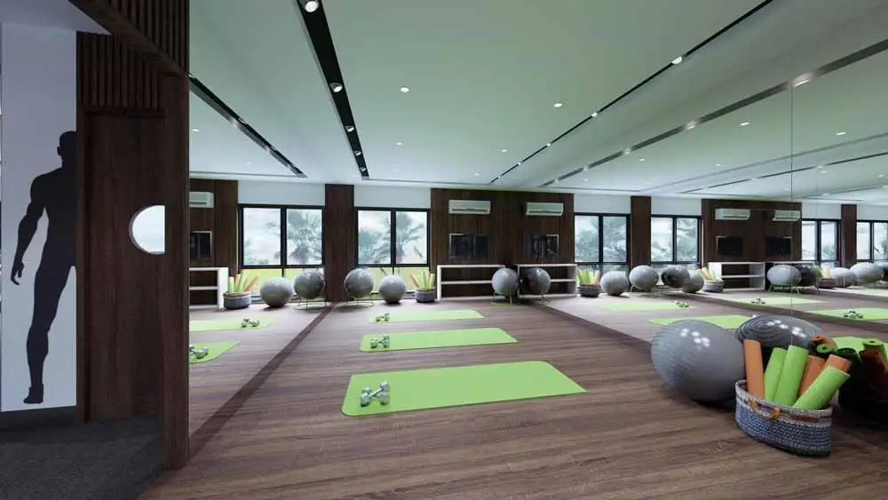 A yoga studio with mats, exercise balls, and a mirror.