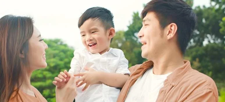 Filipino family sharing a joyful moment at Likha Estates, a purposeful residential real estate investment by PHINMA Properties.