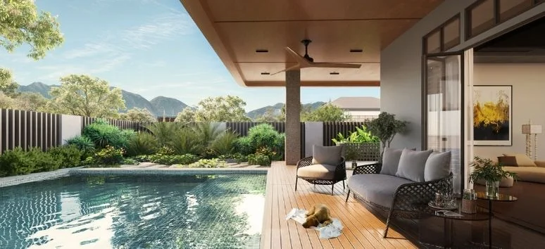 Modern poolside lounge with mountain views, showcasing the "practical luxury" achieved by choosing the right property developers.