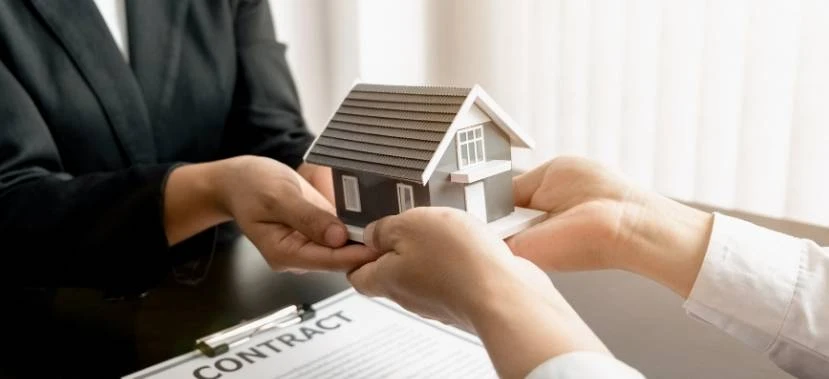 Professional consultation meeting focused on transparency and what reservation fee covers when buying a house for new homeowners.