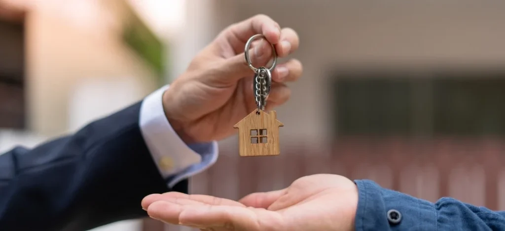 Close-up of a key handover representing the successful completion of a home-buying timeline at Maayo Tugbok.