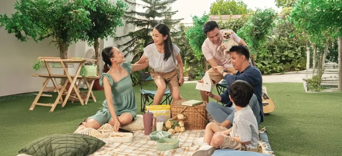 Residents bonding in a shared green space, reflecting the phinma bayanihan mission and vision for communities.